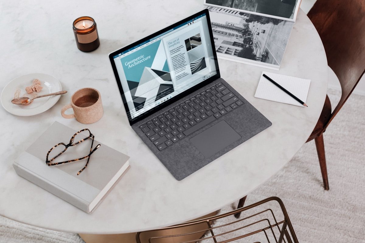 Person working at a laptop in a home office